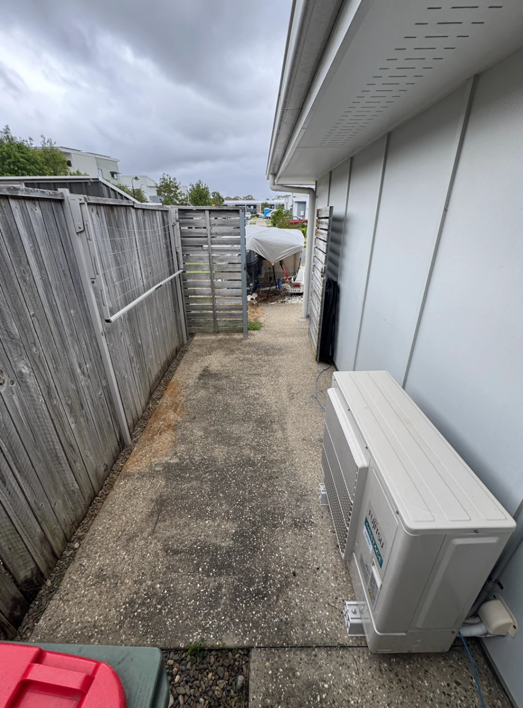 Concrete side path with rust stains and built-up dirt